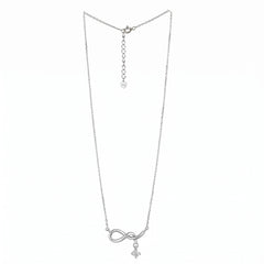 A delicate silver chain necklace featuring an infinity symbol pendant with a small cross charm hanging below, displayed against a solid white background infinity drop necklace.
