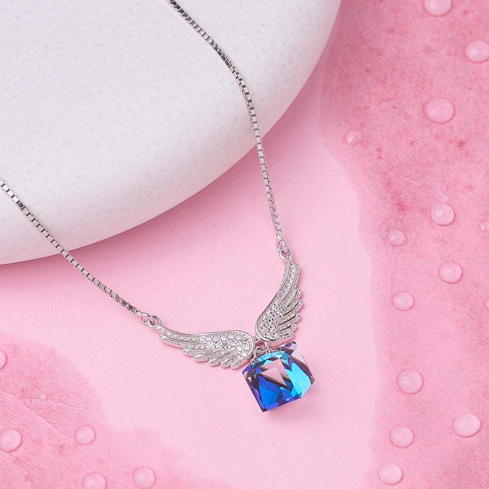 925 Silver Necklace with a blue and pink pendant on a pink surface