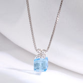 Necklace with a blue gemstone pendant on a white background 925 silver pendant for women.