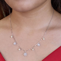 925 Silver Necklace with floral pendants on a person wearing a red top