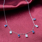 925 silver Necklace with square-shaped gemstones on a red fabric background