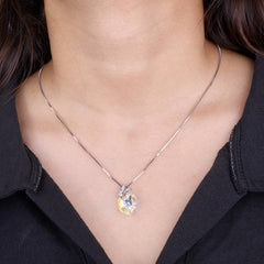 Heart-shaped pendant necklace on a person wearing a black shirt