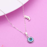 Silver necklace with a blue evil eye pendant on a pink background 925 Silver pendant for women