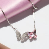 925 silver Necklace with a pink butterfly pendant on a pink fabric background