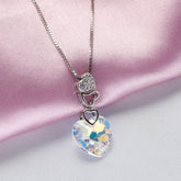 Necklace with a heart-shaped pendant and crystal element on a pink fabric background 925 Silver Pendant for Women