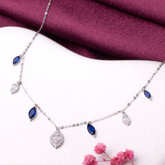 925 silver Necklace with blue gemstones and a diamond pendant on a white surface with a purple fabric background