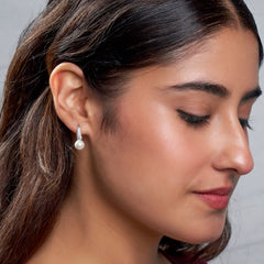 Silver Crescent shaped Pearl drop earrings in Bali pattern