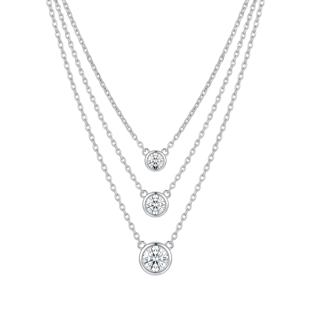 Three silver necklaces with round diamond pendants for women