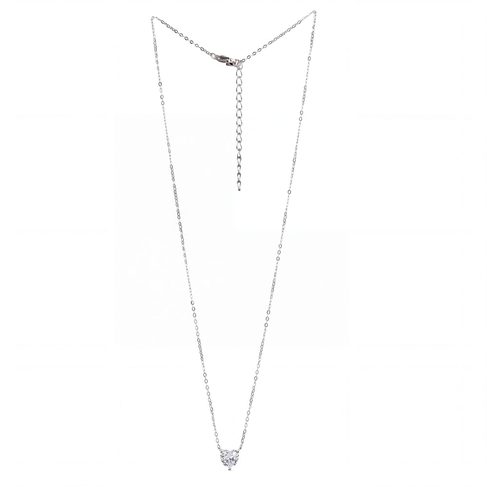 A delicate silver chain necklace with a small heart-shaped clear gemstone pendant, displayed against a plain white background.