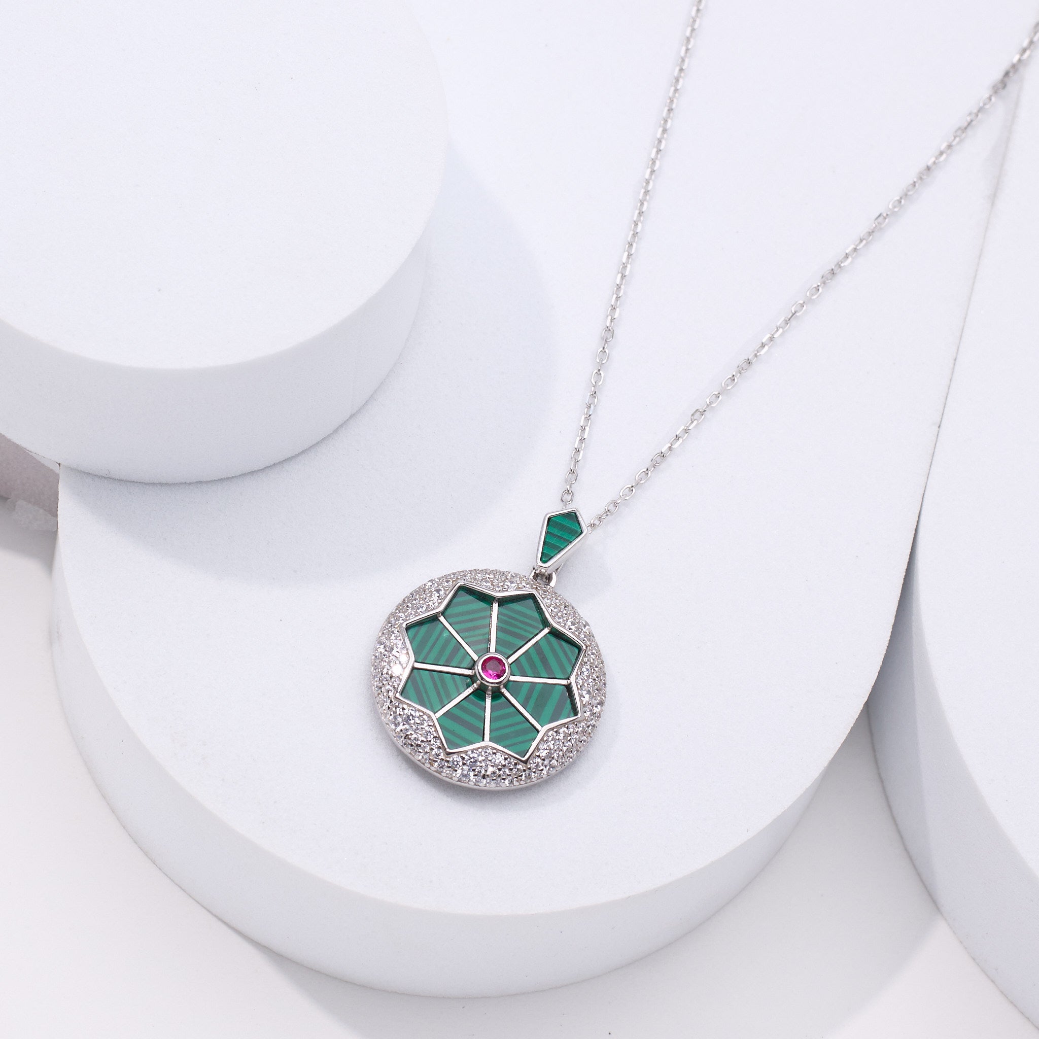 Silver necklace with a green pendant for women