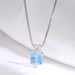 Necklace with a blue gemstone pendant on a white background 925 silver pendant for women.