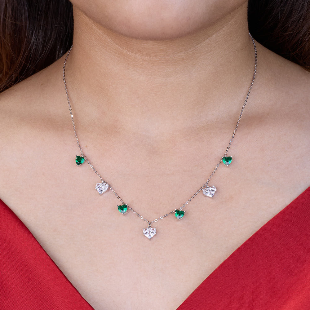 925 silver Necklace with green and clear gemstones worn by a person in a red top