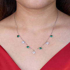 925 silver Necklace with green and clear gemstones worn by a person in a red top