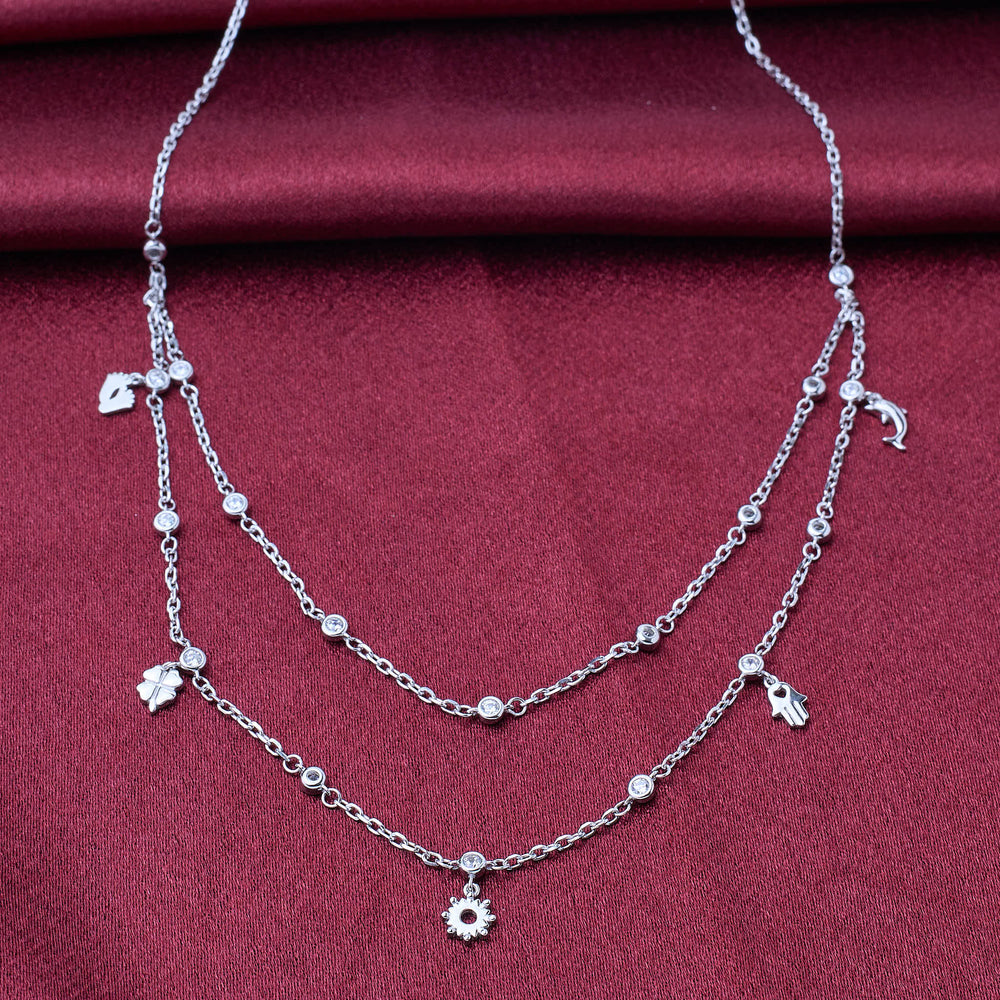925 silver Silver necklace with floral charms on a red fabric background