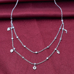 925 silver Silver necklace with floral charms on a red fabric background