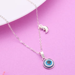 Silver necklace with a blue evil eye pendant on a pink background 925 Silver pendant for women