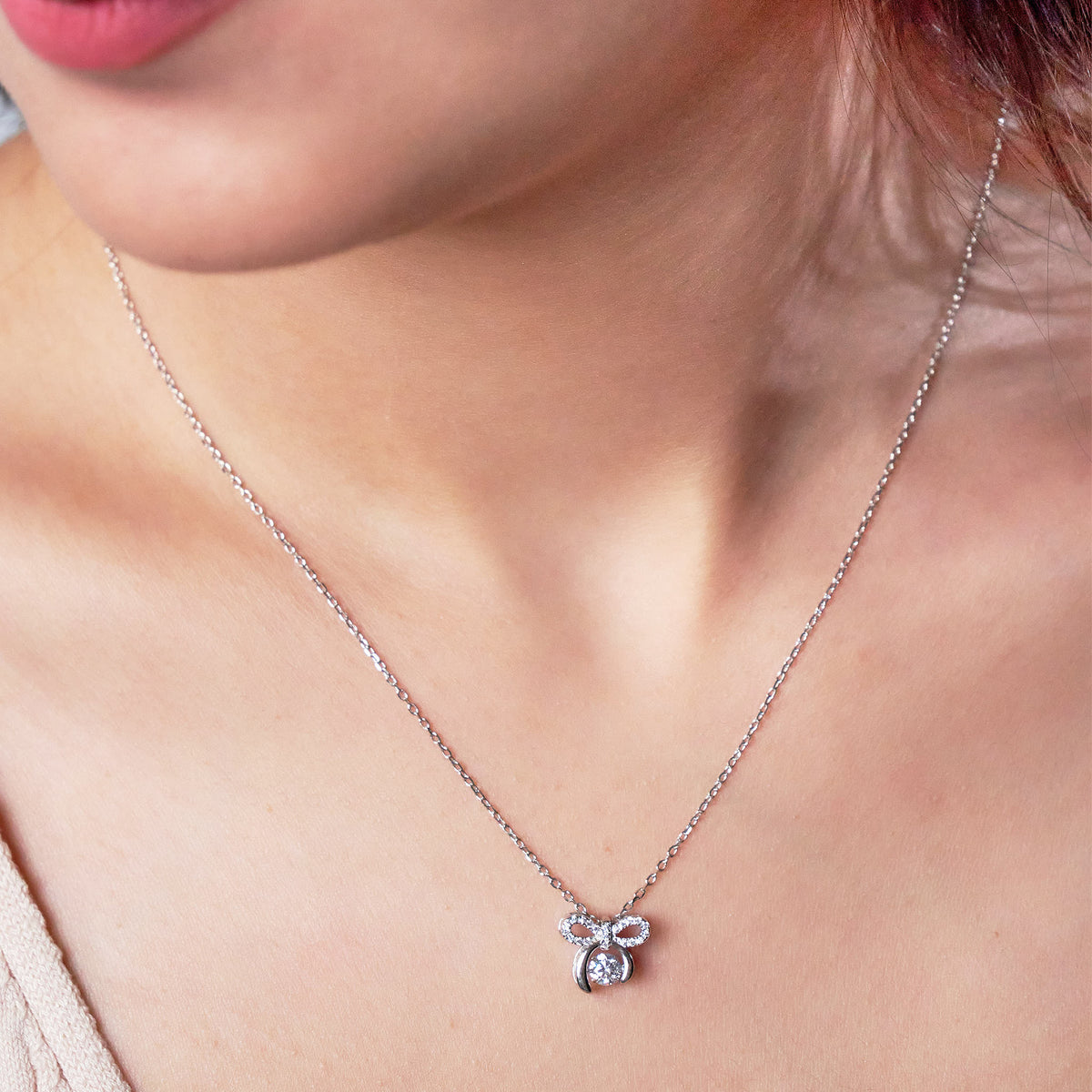 Pure 925 Silver pookie bow pendant necklace wearing a model 