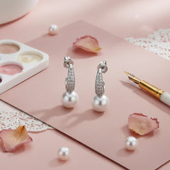 Silver Crescent shaped Pearl drop earrings in Bali pattern