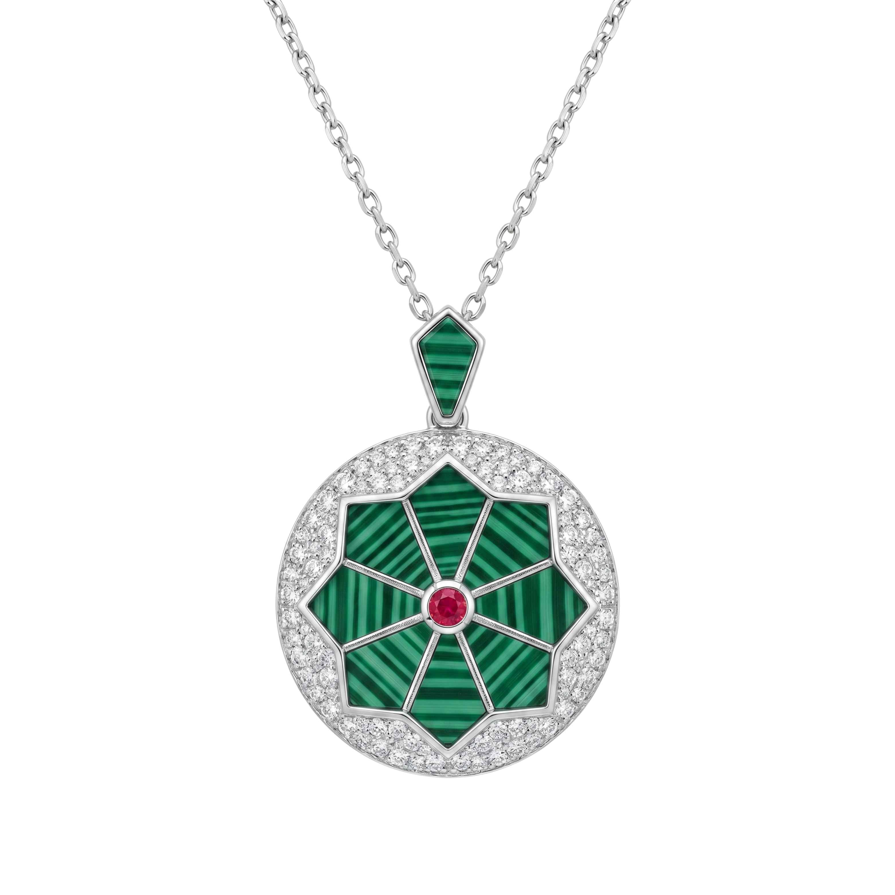 Jewelry necklace with a green pendant and red gemstone on a white background for women