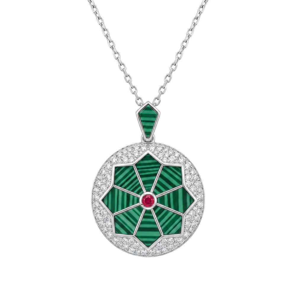 Jewelry necklace with a green pendant and red gemstone on a white background for women